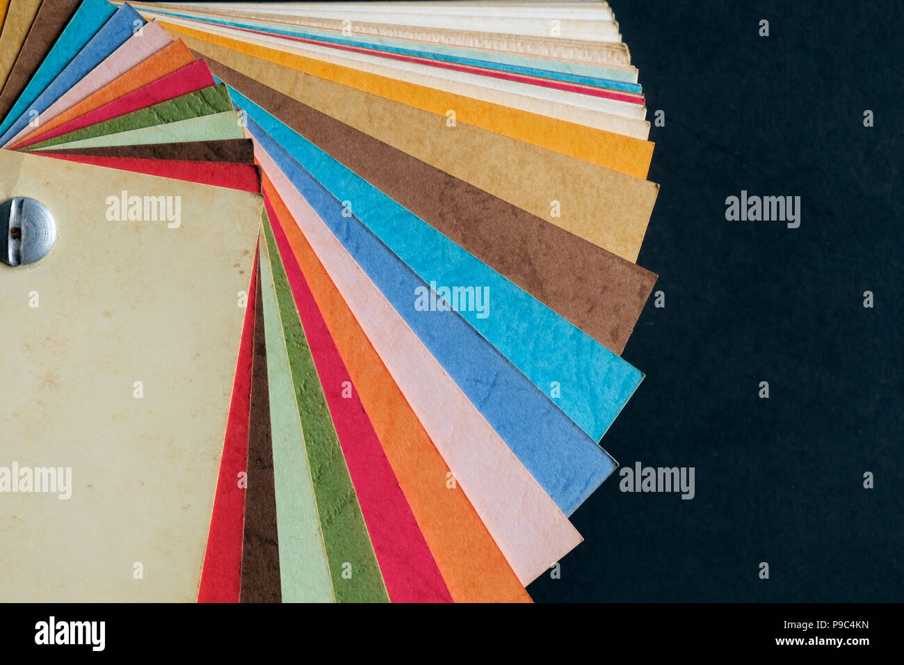 Colorful example paper for sale on black paper Stock Photo Alamy