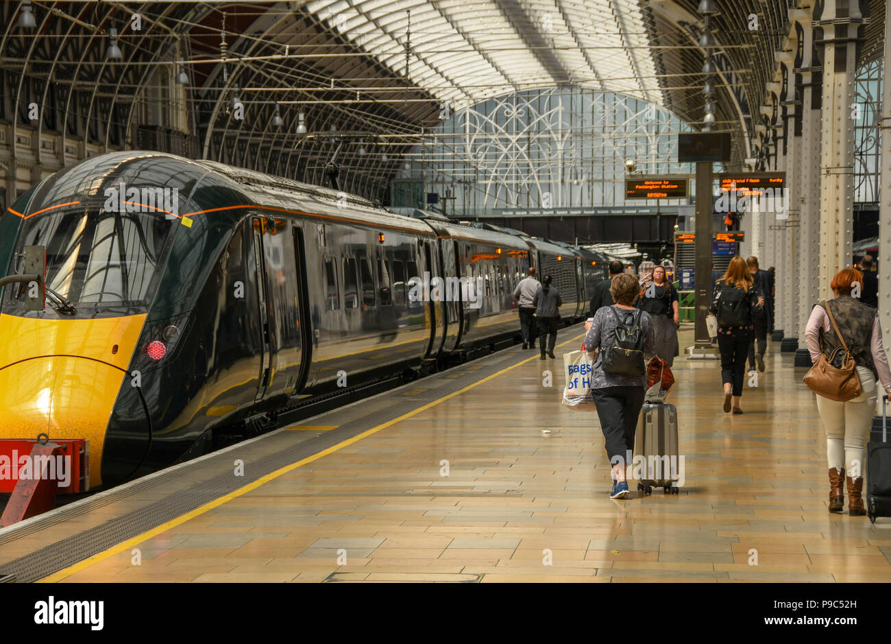 New Class 800 electro diesel train in London Paddington railway station with people on the platform. It is operated by Great Western Railway Stock Photo