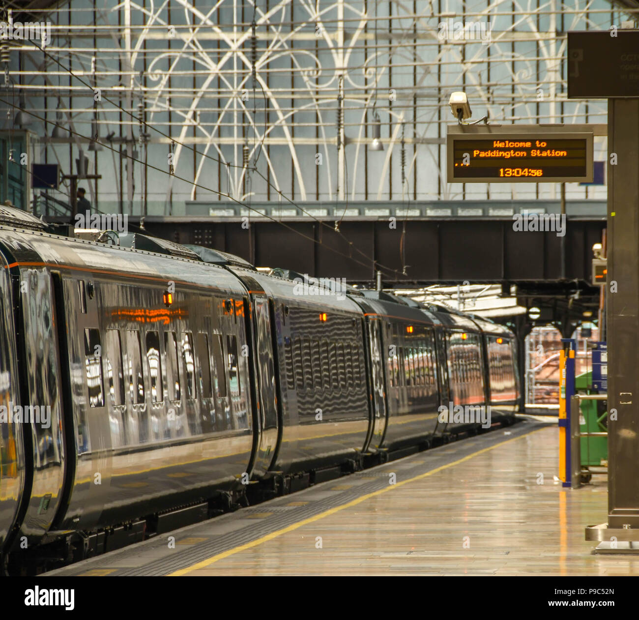 Carriages of a a new inter city train alongside a platform in London Paddington railway station. It is operated by Great Western Railway Stock Photo