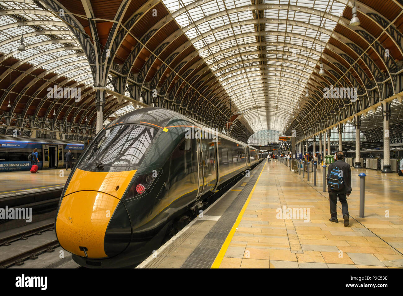 New Class 800 electro diesel train in London Paddington railway station with people on the platform. It is operated by Great Western Railway Stock Photo