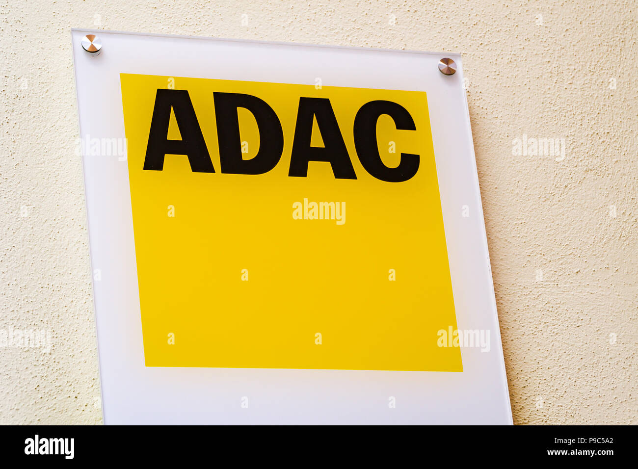 Wiesbaden, Germany - June 03 2018: ADAC logo on a facade. ADAC founded in 1903, is an automobile club in Germany, the largest of Europe. Stock Photo