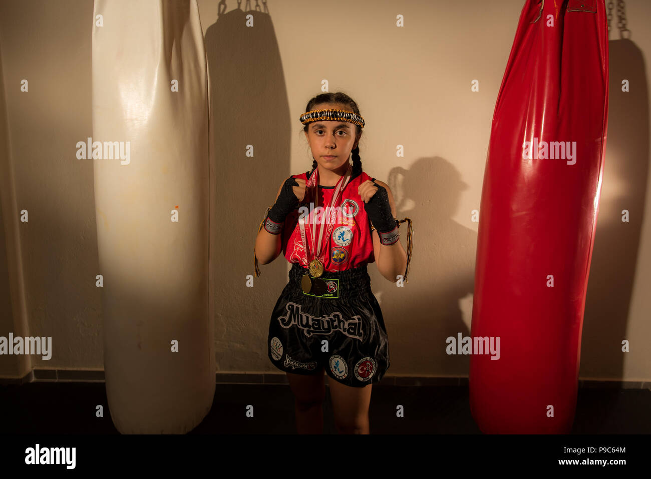 Young girl female junior kick boxer Muay Thai MMA boxing fighter Stock Photo