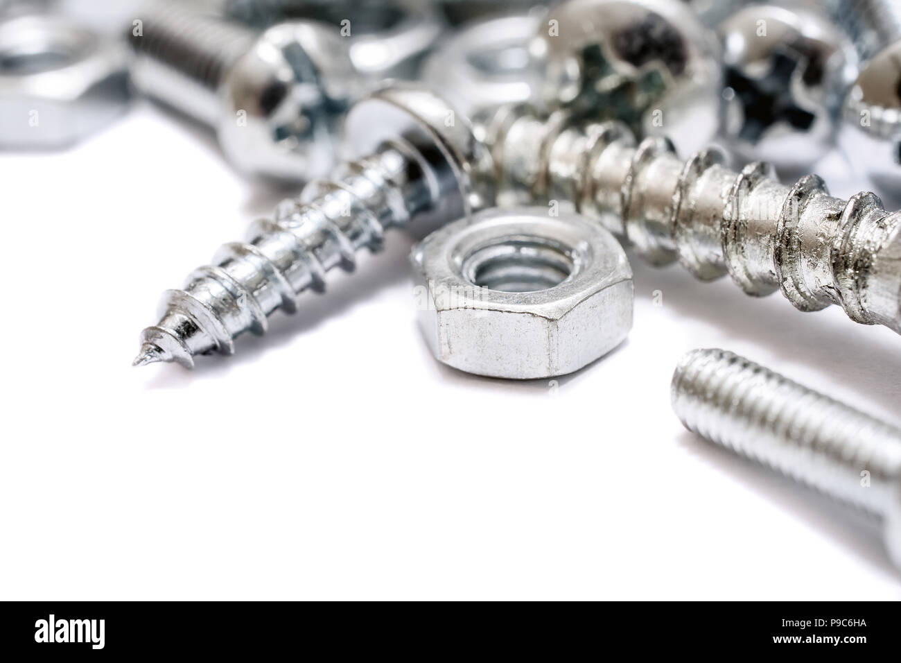 Macro Of A Small Collection Of Iron Screws, Wood Screws And Bolts With Free Space Stock Photo