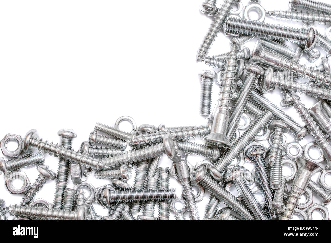 Big Collection Of Iron Screws, Wood Screws and Bolts With A Free Rectangle For Text In The Upper Left Corner Stock Photo