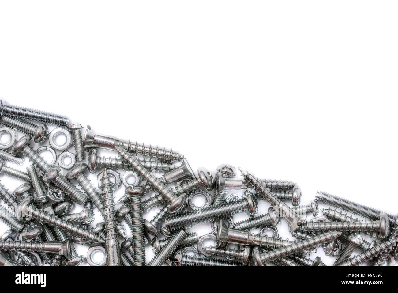 Medium Size Collection Of Iron Screws, Wood Screws and Bolts With A Diagonal Line For Text Stock Photo