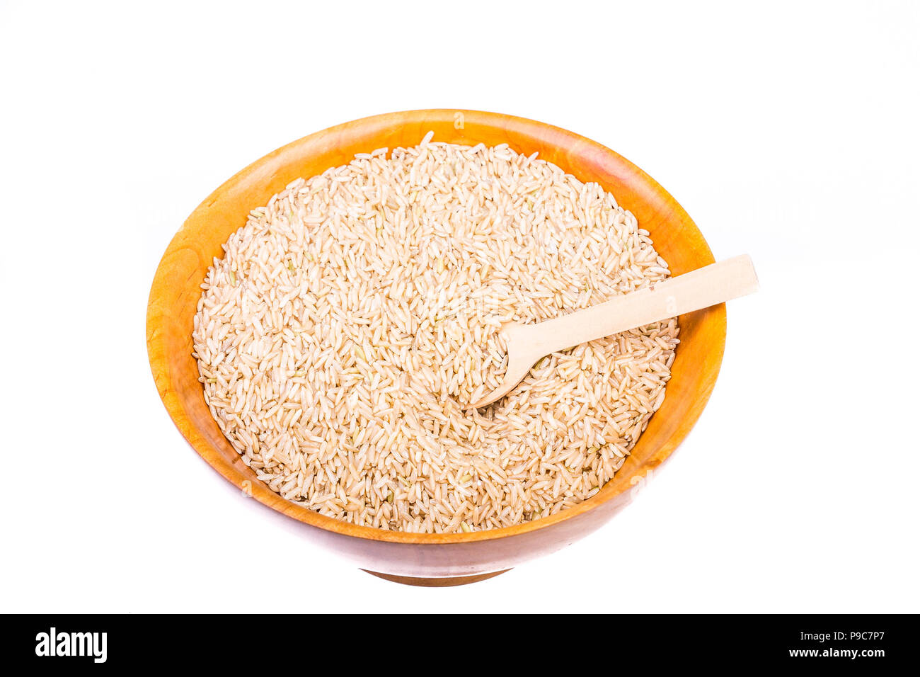 Brown Rice in a Wood Bowl on White Stock Photo