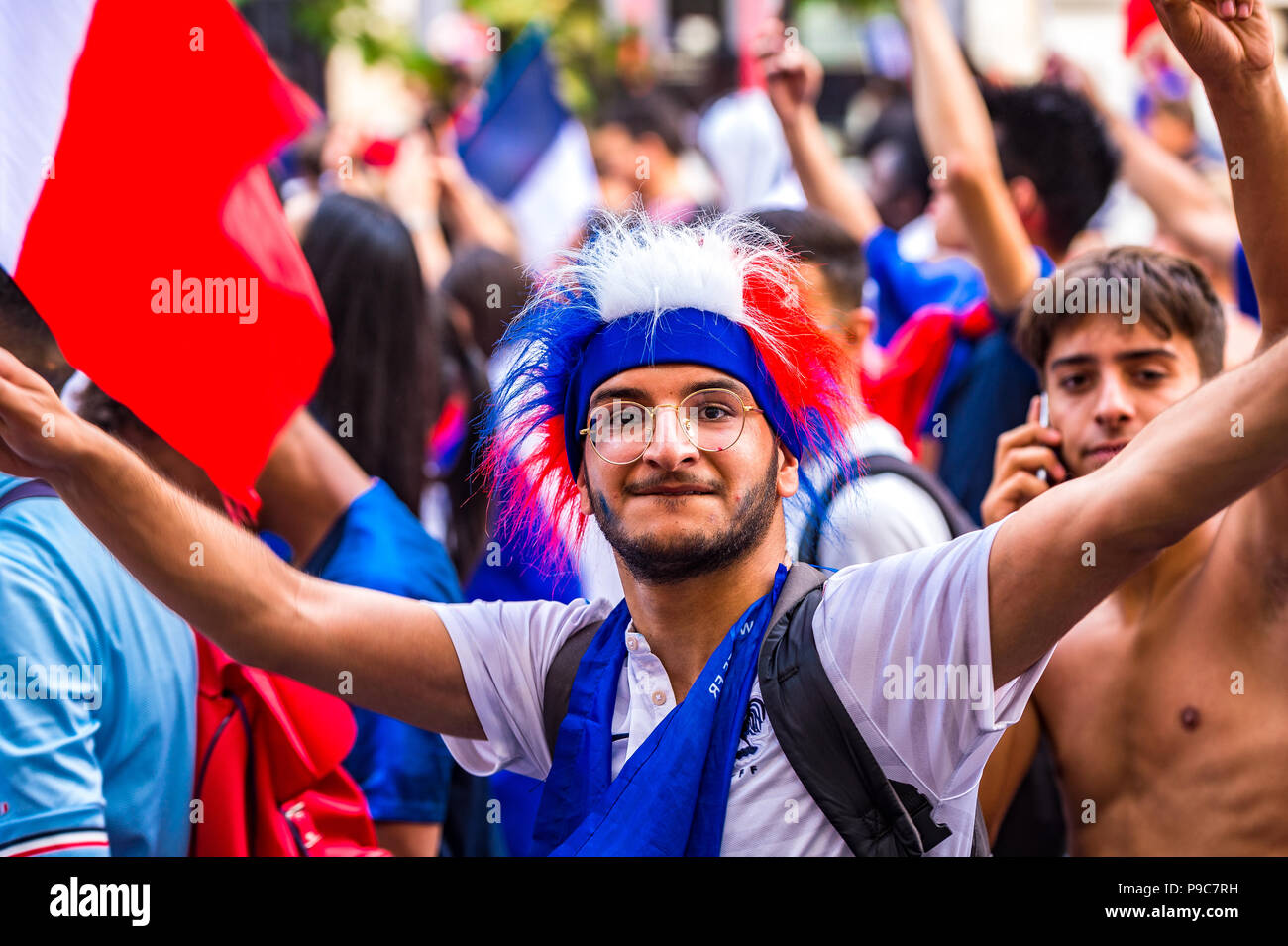 Paris, France. 15th July, 2018. Large crowds celebrate in the streets of Paris after France wins the 2018 FIFA World Cup Russia. Paris, France. Stock Photo