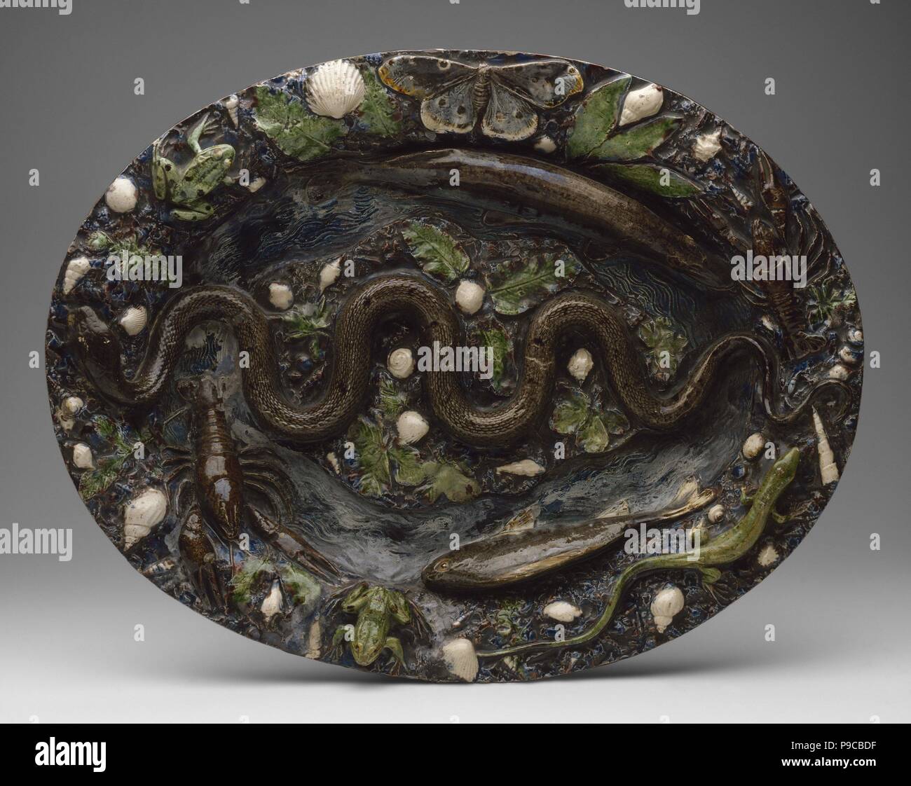 Rustic Ware: Dish with Animal and Plant Ornaments. Museum: State Hermitage, St. Petersburg. Stock Photo