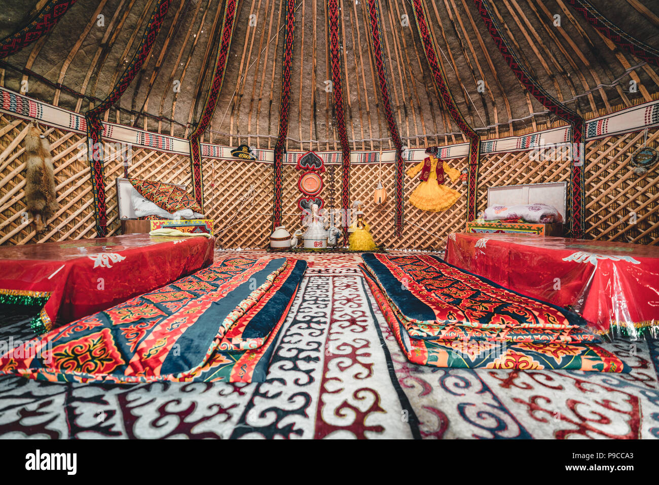 National traditional decoration of the yurt ceiling. Kazakhstani ornament. Vintage weaving of patterns. Yurt decoration. Wooden frame with patterns as an ethnic background, golden horde, Kazakhstan. Stock Photo