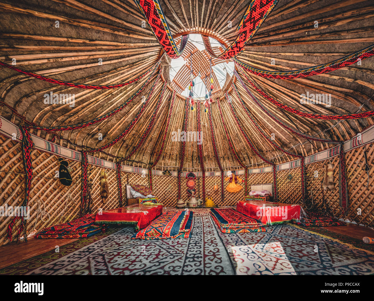 National traditional decoration of the yurt ceiling. Kazakhstani ornament. Vintage weaving of patterns. Yurt decoration. Wooden frame with patterns as an ethnic background, golden horde, Kazakhstan. Stock Photo