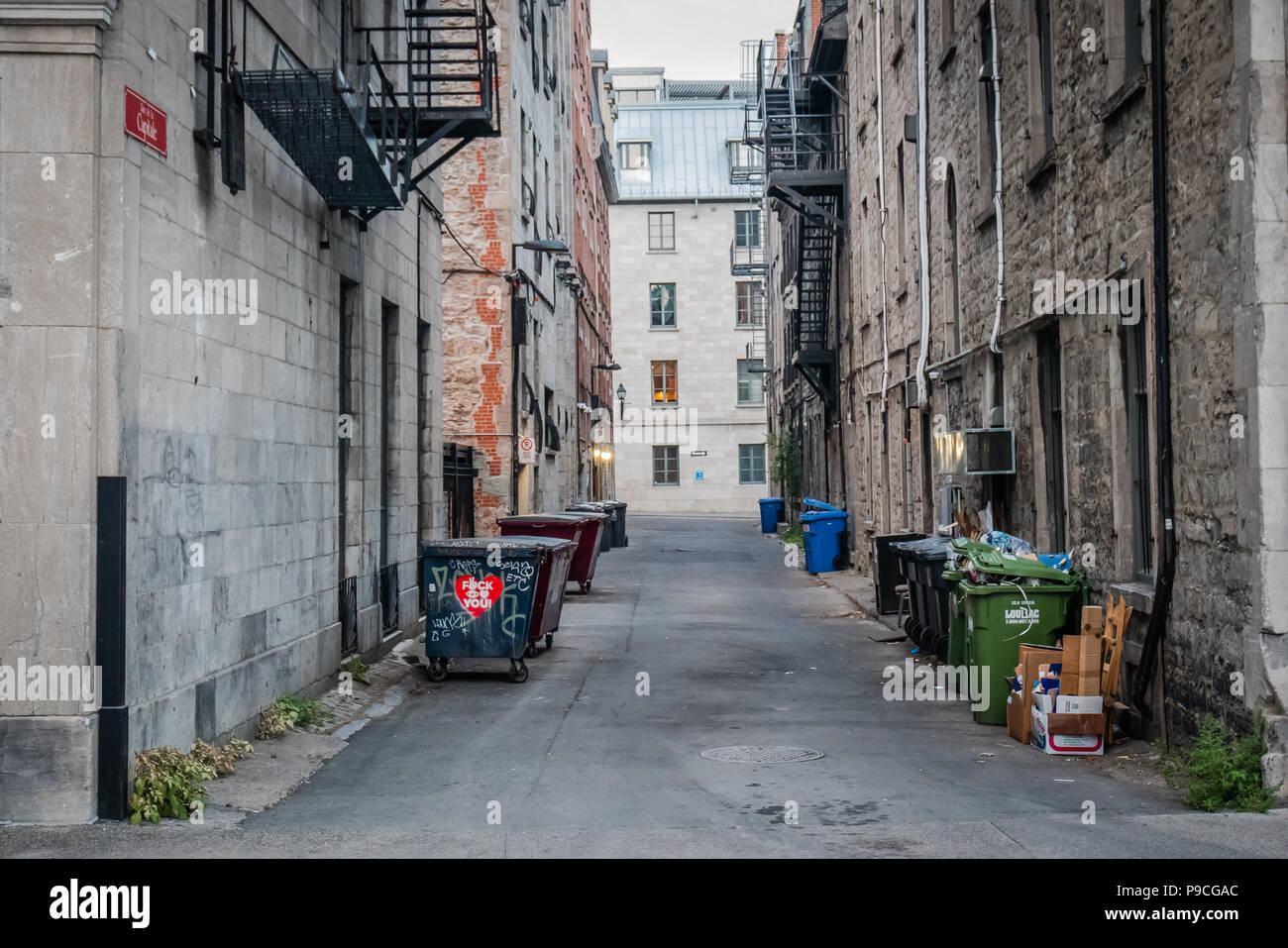 back alley and garbage bins old montreal Stock Photo Alamy