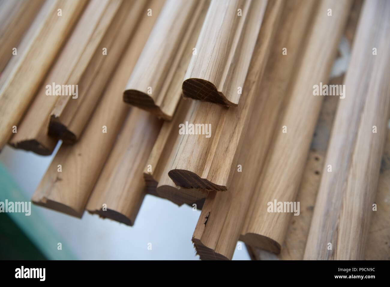 Oak mouldings: a number of lengths of decorative oak nosing Stock Photo