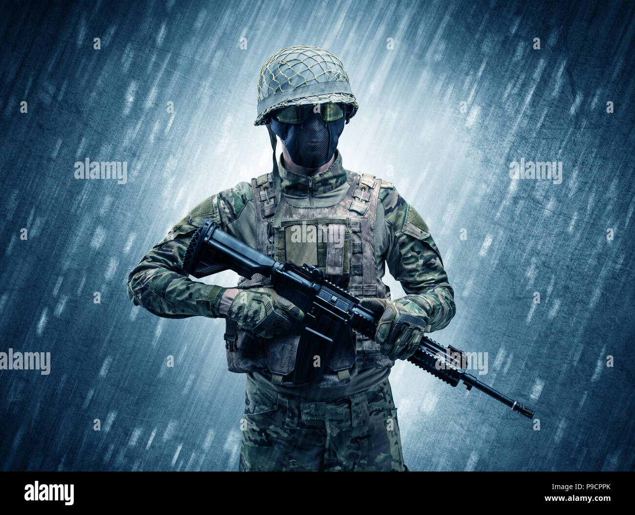 Armed soldier standing in rainy weather concept Stock Photo Alamy