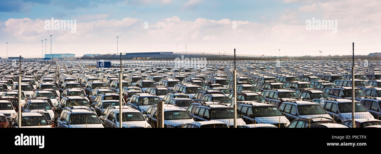 Thousands of imports of new imported cars parked in rows at Immingham