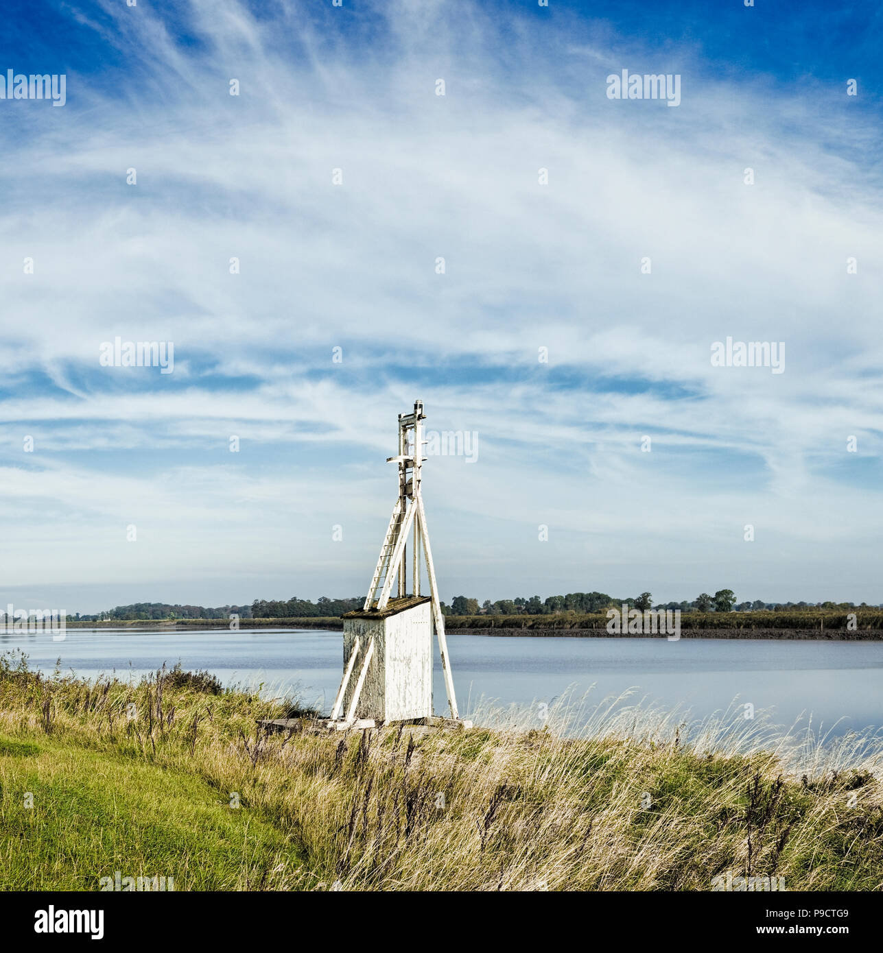 Tidal River Ouse and beacon at Reedness, East Yorkshire, UK Stock Photo