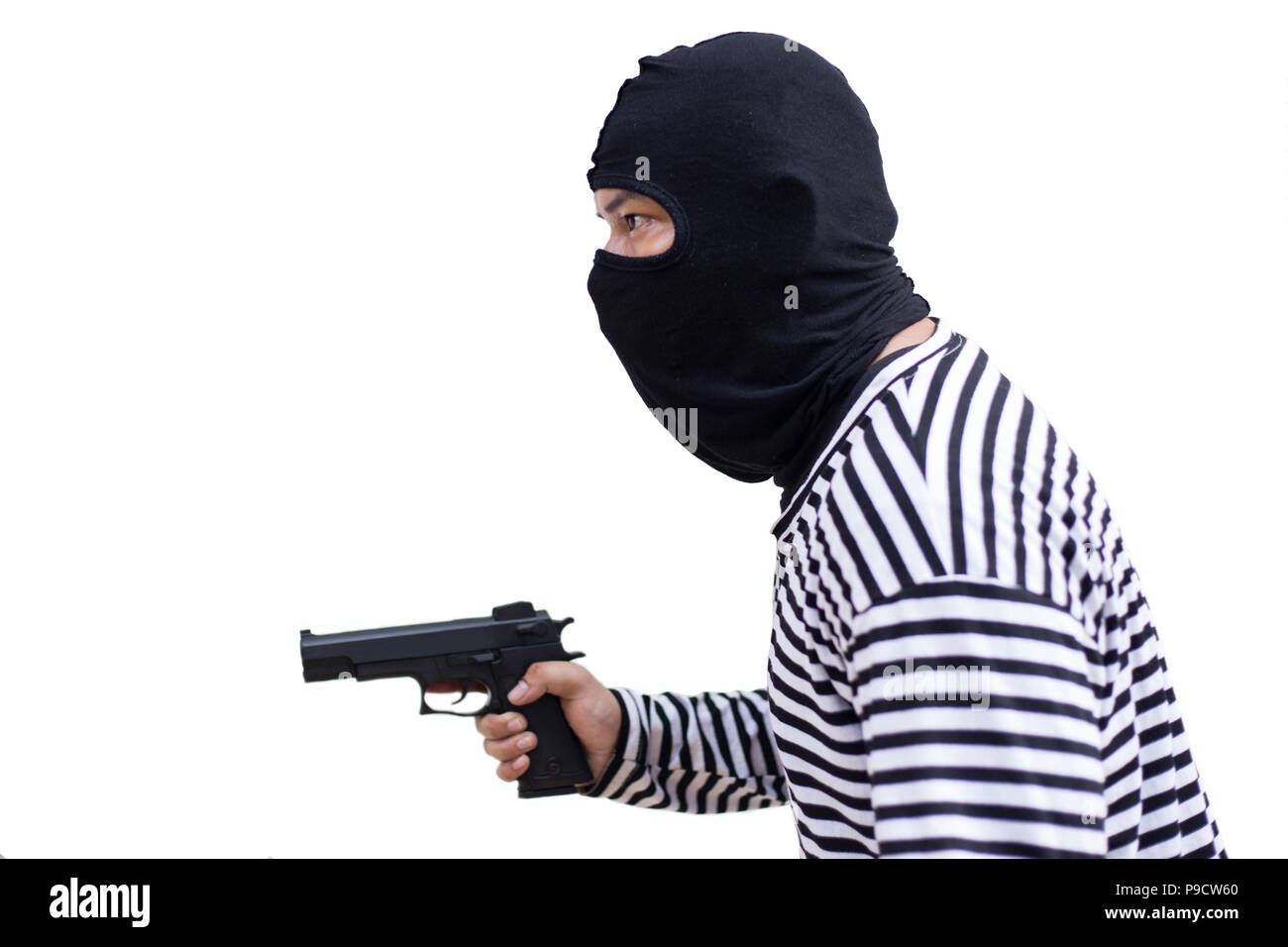 thief or murder hold pistol gun and look at the target for the money on isolate white background in a concept of life, thief, money, safe Stock Photo
