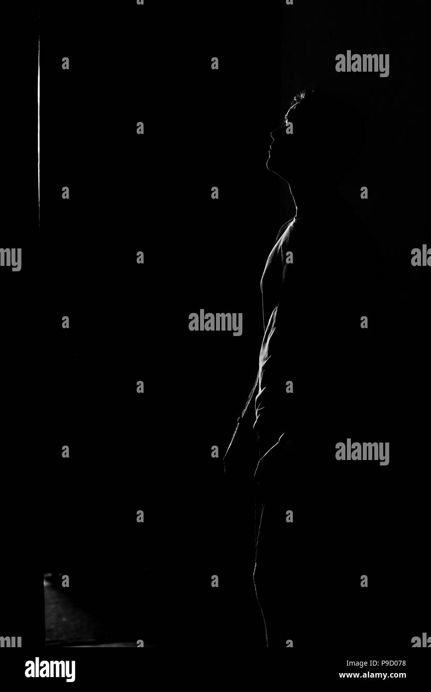 Man standing side view Black and White Stock Photos & Images - Alamy