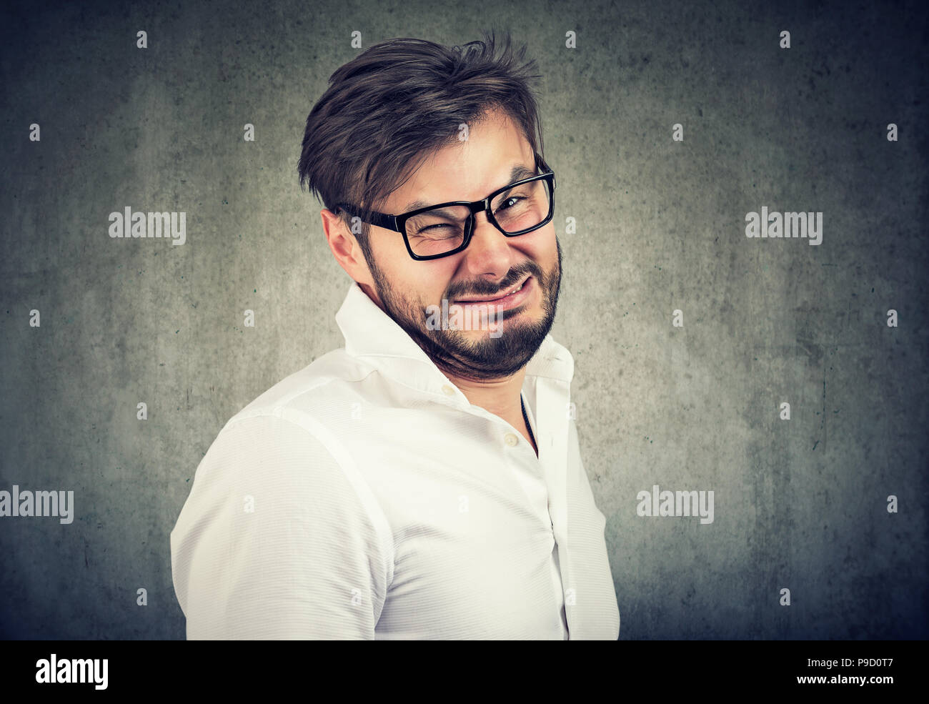Portrait of a disgusted young man Stock Photo