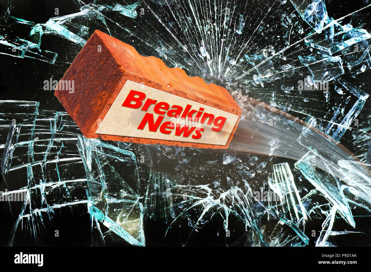 Breaking news with brick going through glass window. Stock Photo