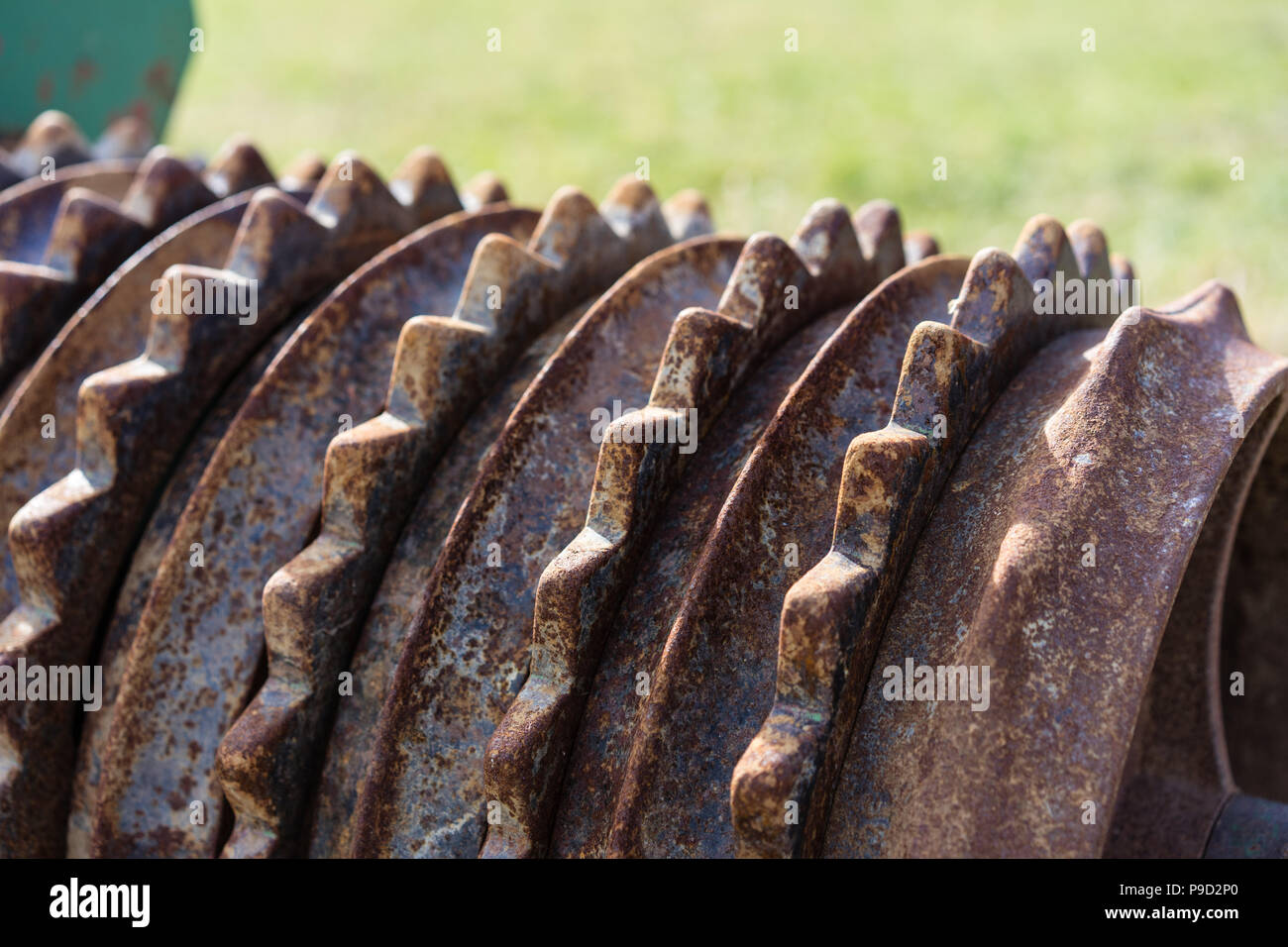 old rusty farming roller agricultural tool for soil close up Stock Photo