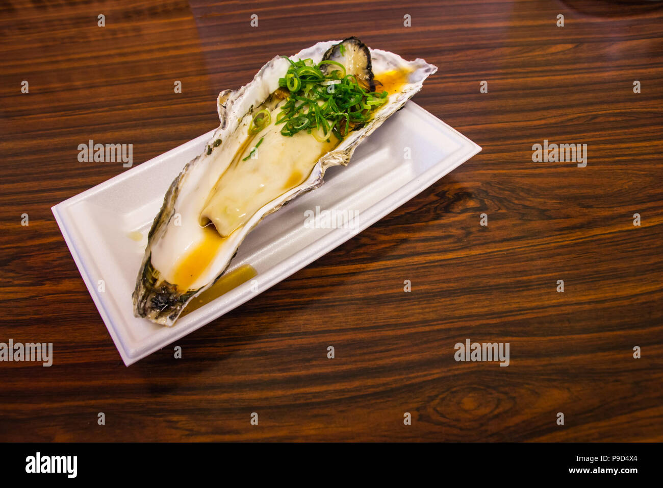 The oyster seasoning with garnish japanese style at put on the table in