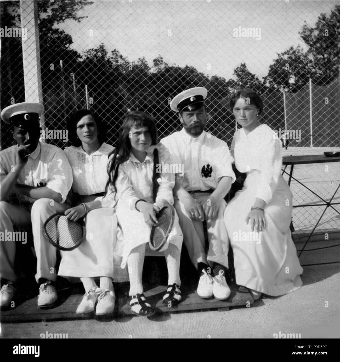 Nicholas II of Russia with daughters on the tennis court. Museum: State Central Museum of Contemporary History of Russia, Moscow. Stock Photo