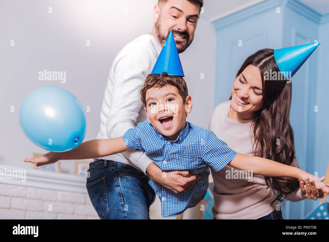 Happy family having birthday party Stock Photo