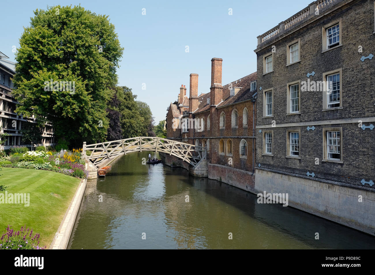 The Mathematical Bridge is the popular name of a wooden footbridge in the southwest of central Cambridge, United Kingdom. It bridges the River Cam about one hundred feet northwest of Silver Street Bridge and connects two parts of Queens' College. Its official name is simply the Wooden Bridge. Stock Photo