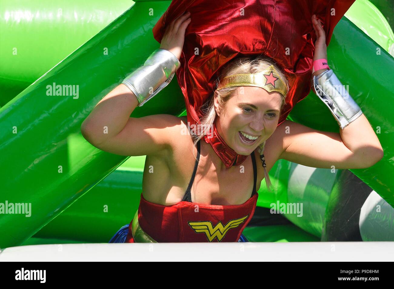 Kapow! Inflatable  5k assault course at Preston Park, Brighton for superheroes in aid of Martlets Stock Photo