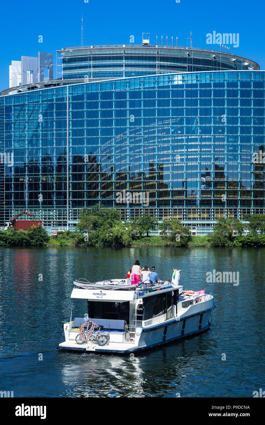 Strasbourg, pleasure boat cruising on Ill river, Louise Weiss building, European Parliament, Alsace, France, Europe, Stock Photo