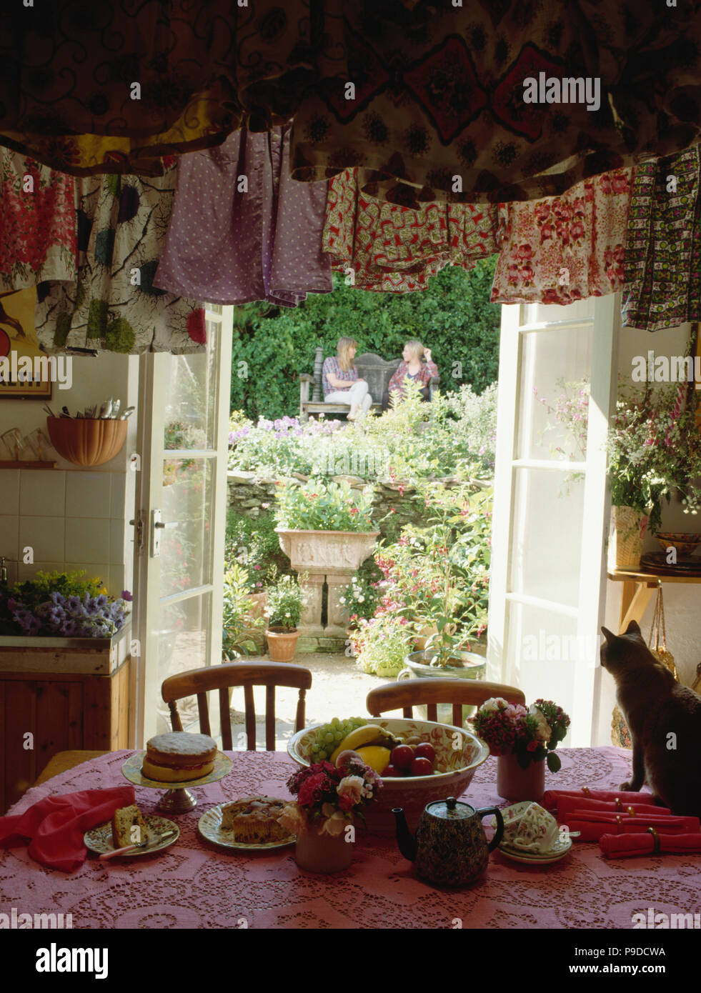 Clothes Hanging On Airer Above Table In Eighties Kitchen