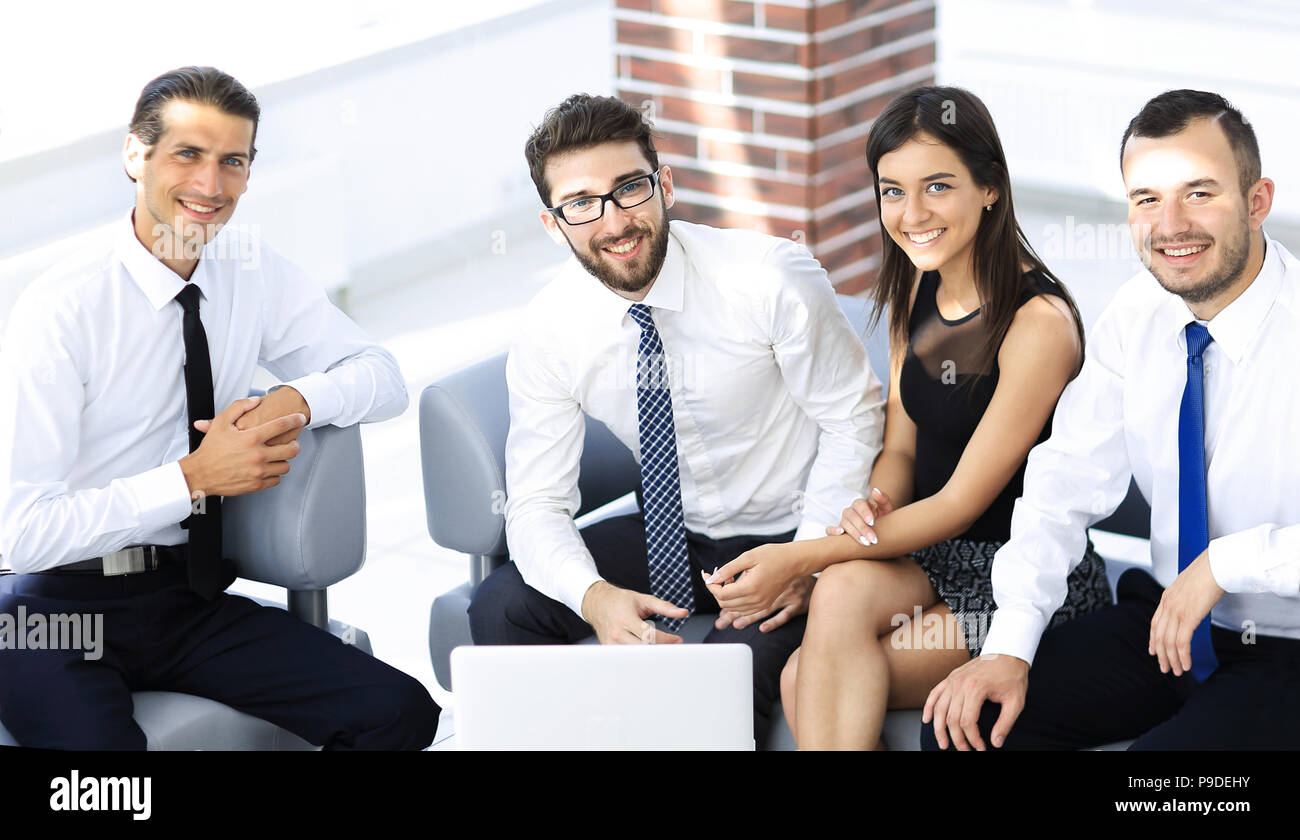 successful business team sitting in office lobby Stock Photo - Alamy