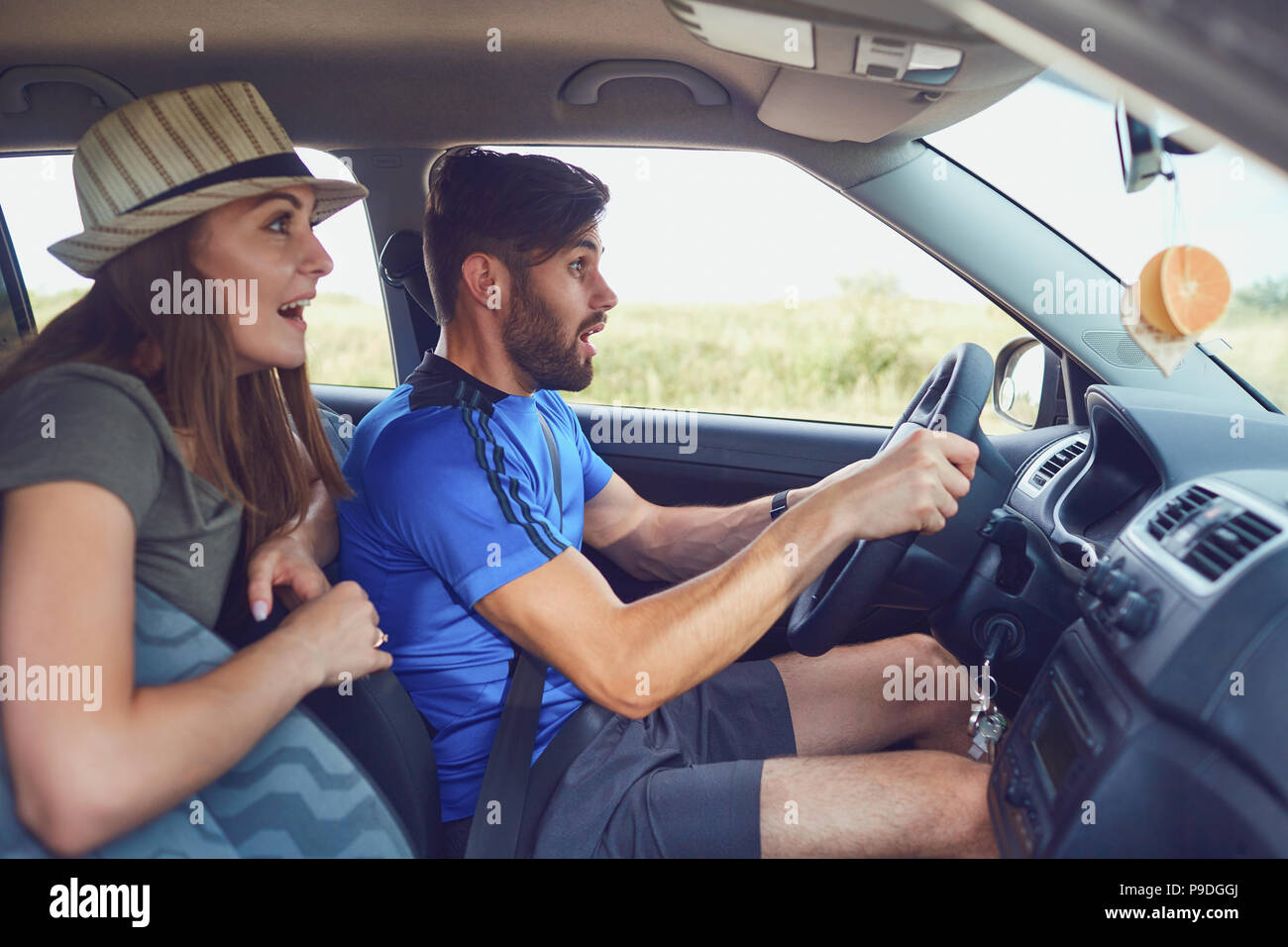 Scared couple in the car  in an accident. Stock Photo