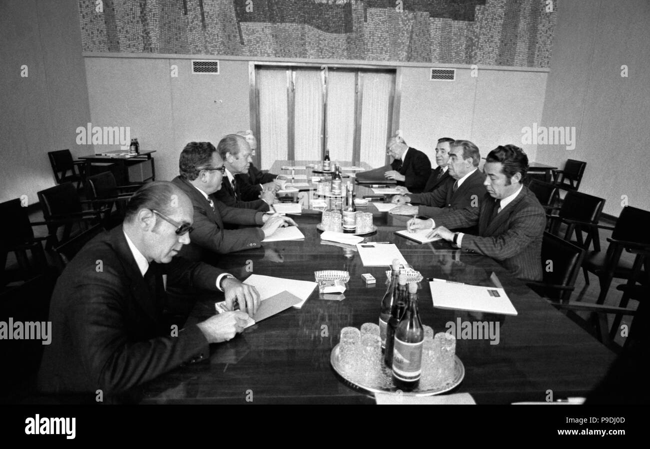 A meeting on the second day of the Vladivostok Summit Meeting, 1974 -. President Ford and Soviet Gen. Secretary Leonid Brezhnev meet to discuss nuclear arms limitations and the signing of a joint communiqué.  Conference Hall-Okeansky Sanitarium, Vladivostok, USSR. November 24, 1974.  [als present are Secretary of State Henry Kissinger, Foreign Minister Andrei Gromyko, Brezhnev’s personal interpreter Victor Sukhodev and others. Stock Photo