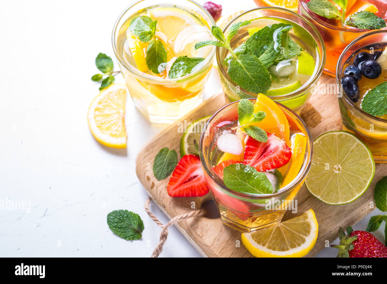 Lemonade set. Cold summer drink assortment. Lemonade, mojito and berry