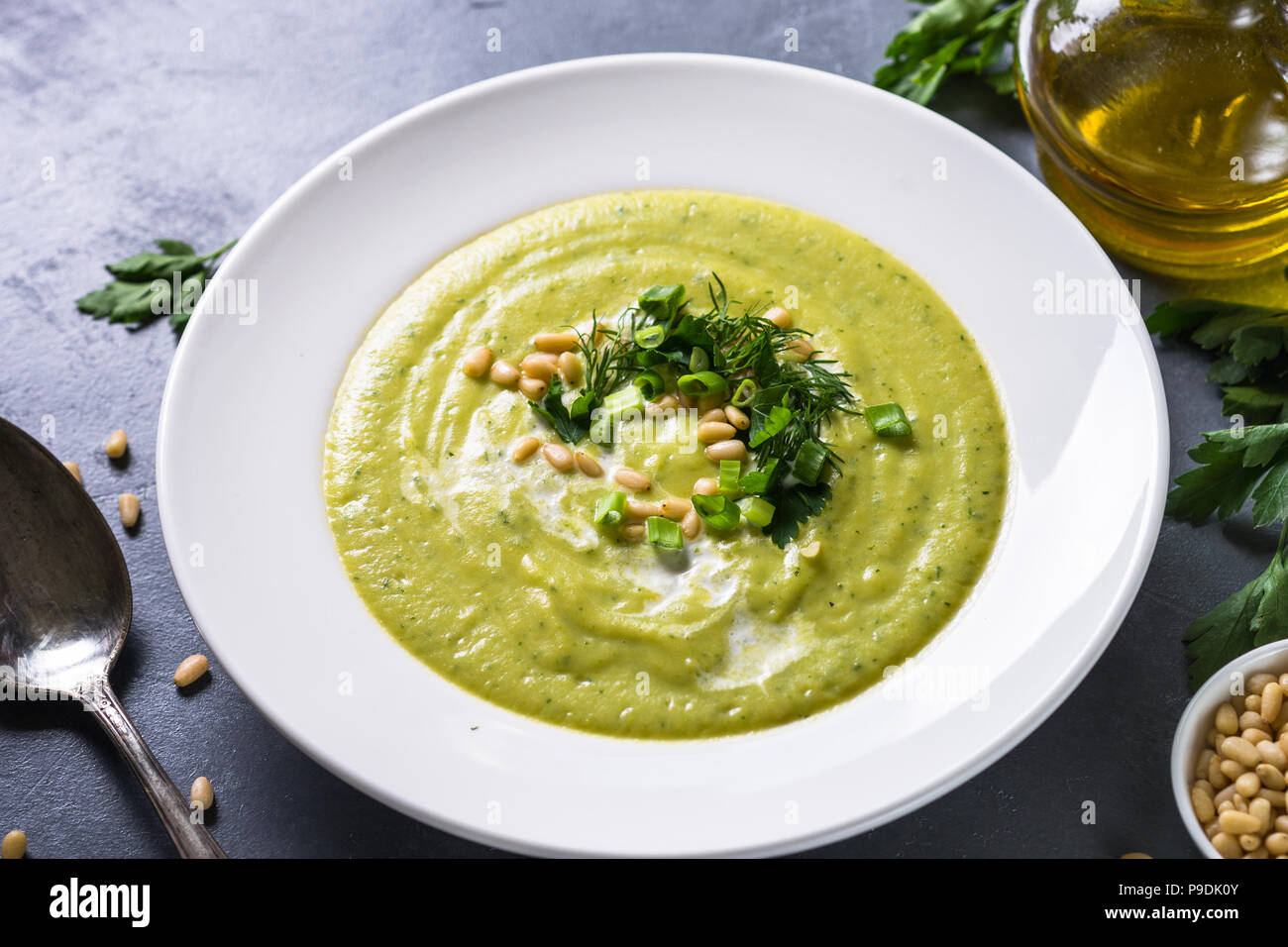 Cream soup with zucchini, herbs and cream.  Diet food, meatless dish. Stock Photo