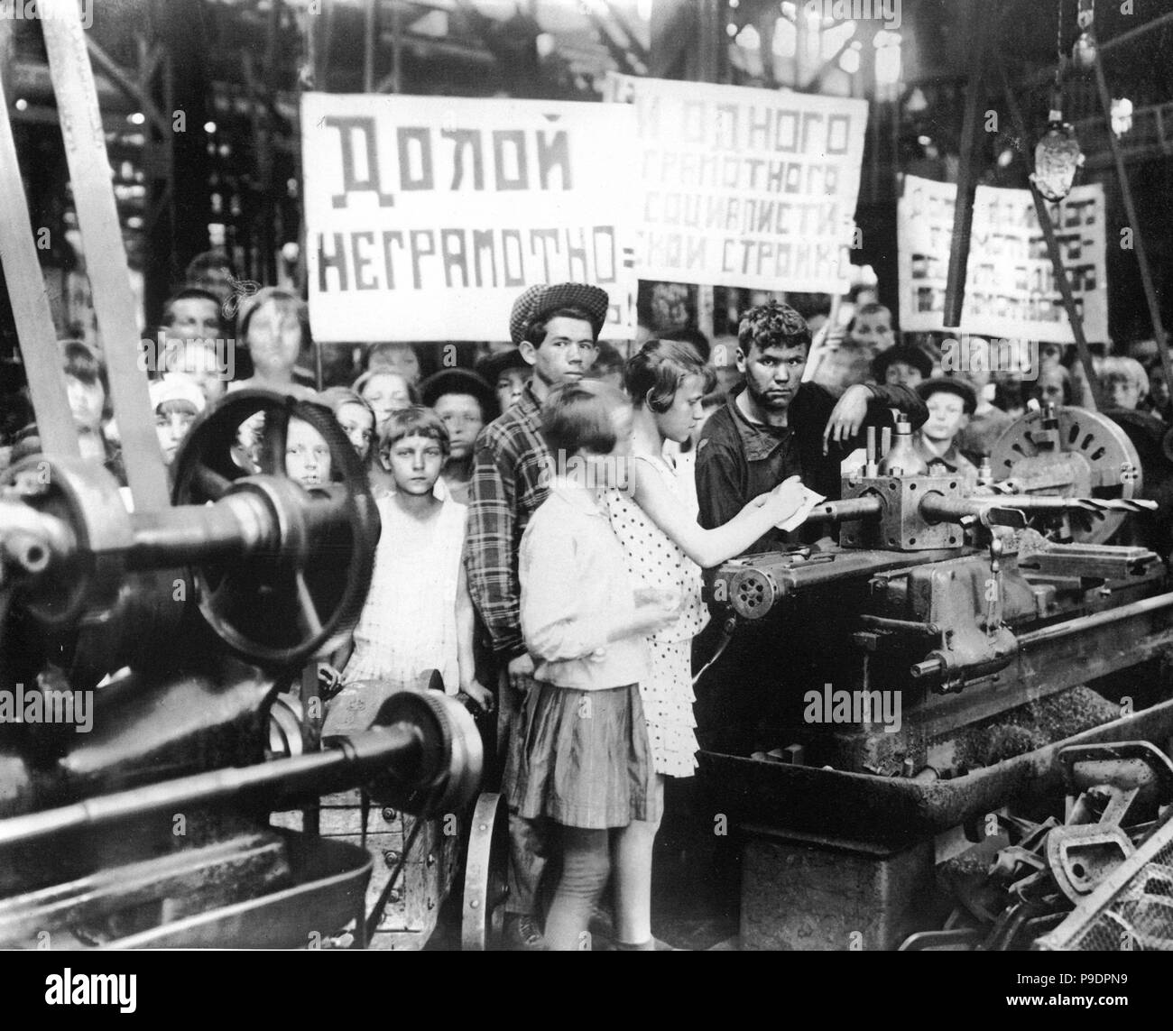 Likbez. Scholars at a factory building. Museum: State History Museum, Moscow. Stock Photo
