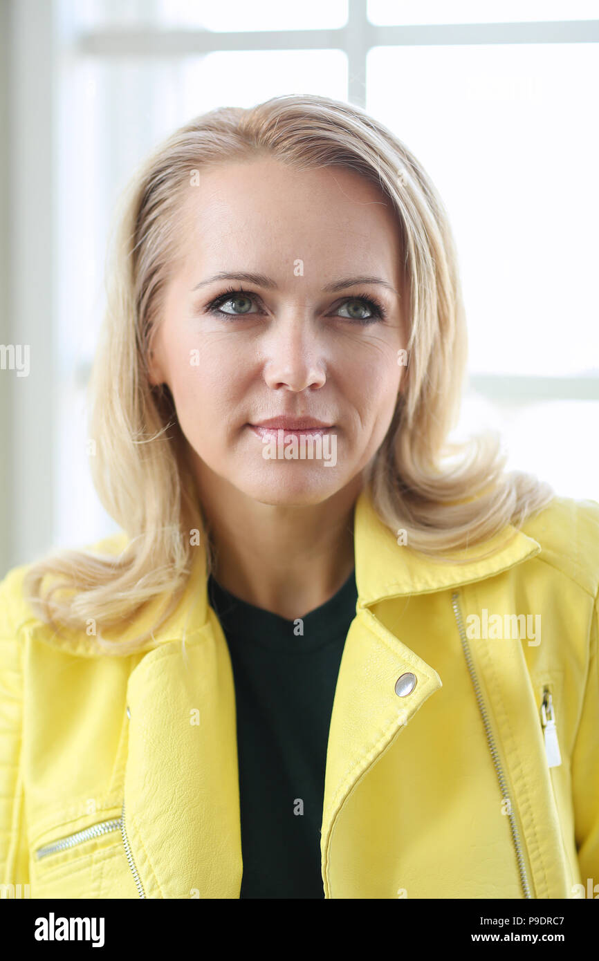 Beautiful woman in yellow jacket Stock Photo Alamy
