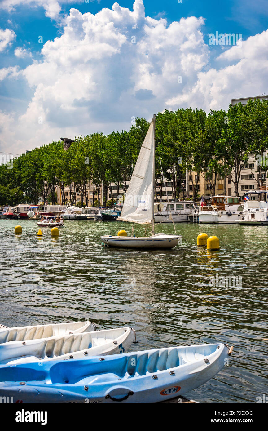 A small sailboat at Bassin de la Villette Stock Photo