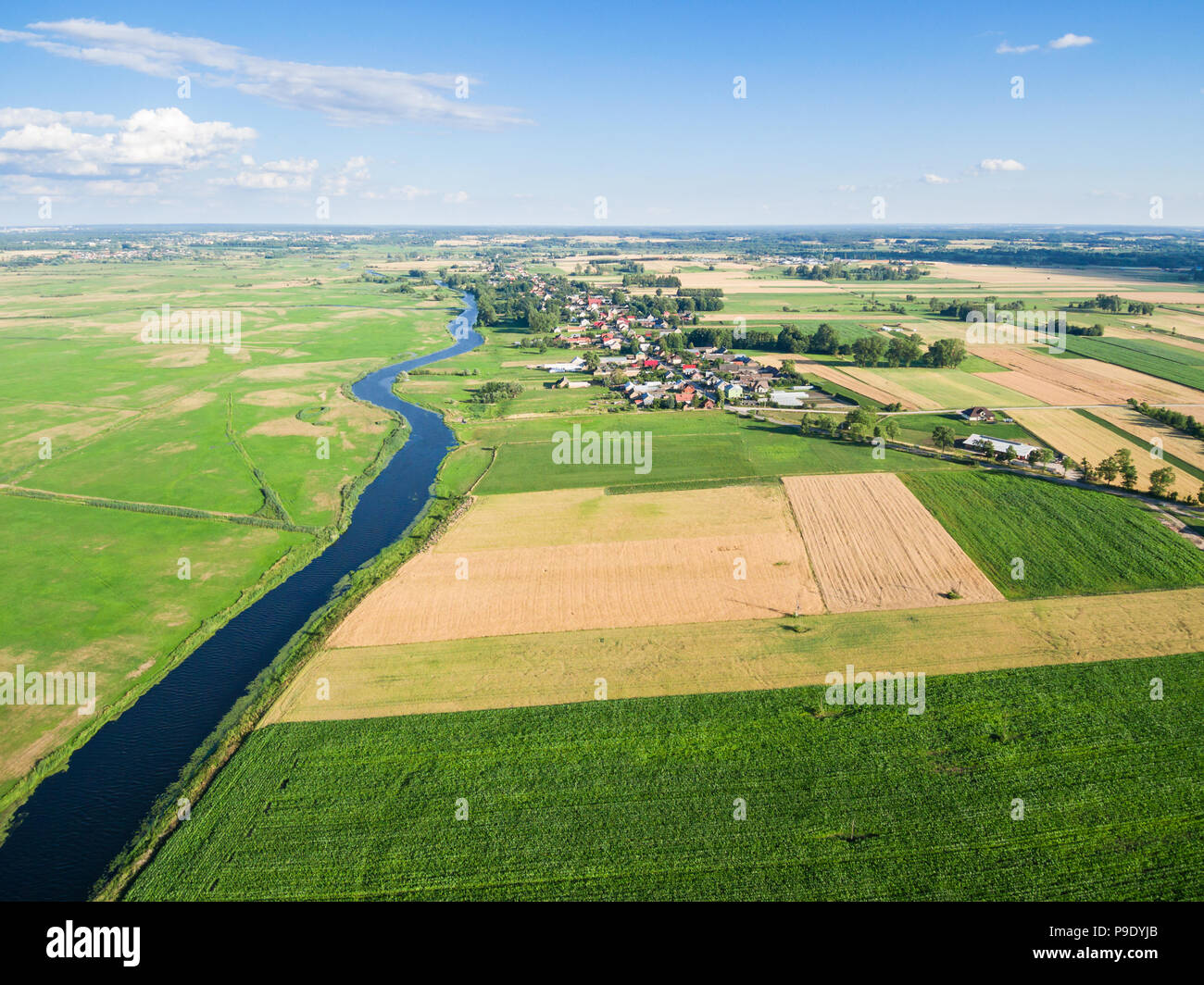 Aerial view of Zlotoria city by a river under blue cloudy sky, Poland Stock Photo