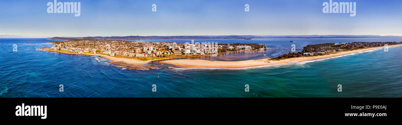 The entrance regional town on Australian Central coast of Pacific where Tuggerah lake enters the ocean via lagoon flowing through sandy dunes and beac Stock Photo