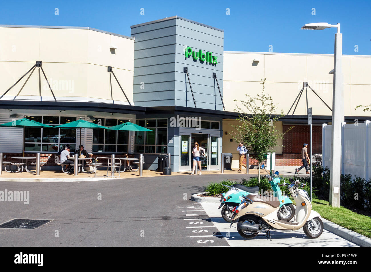 Gainesville Florida,Publix grocery store supermarket,front entrance exterior,parking lot,scooter