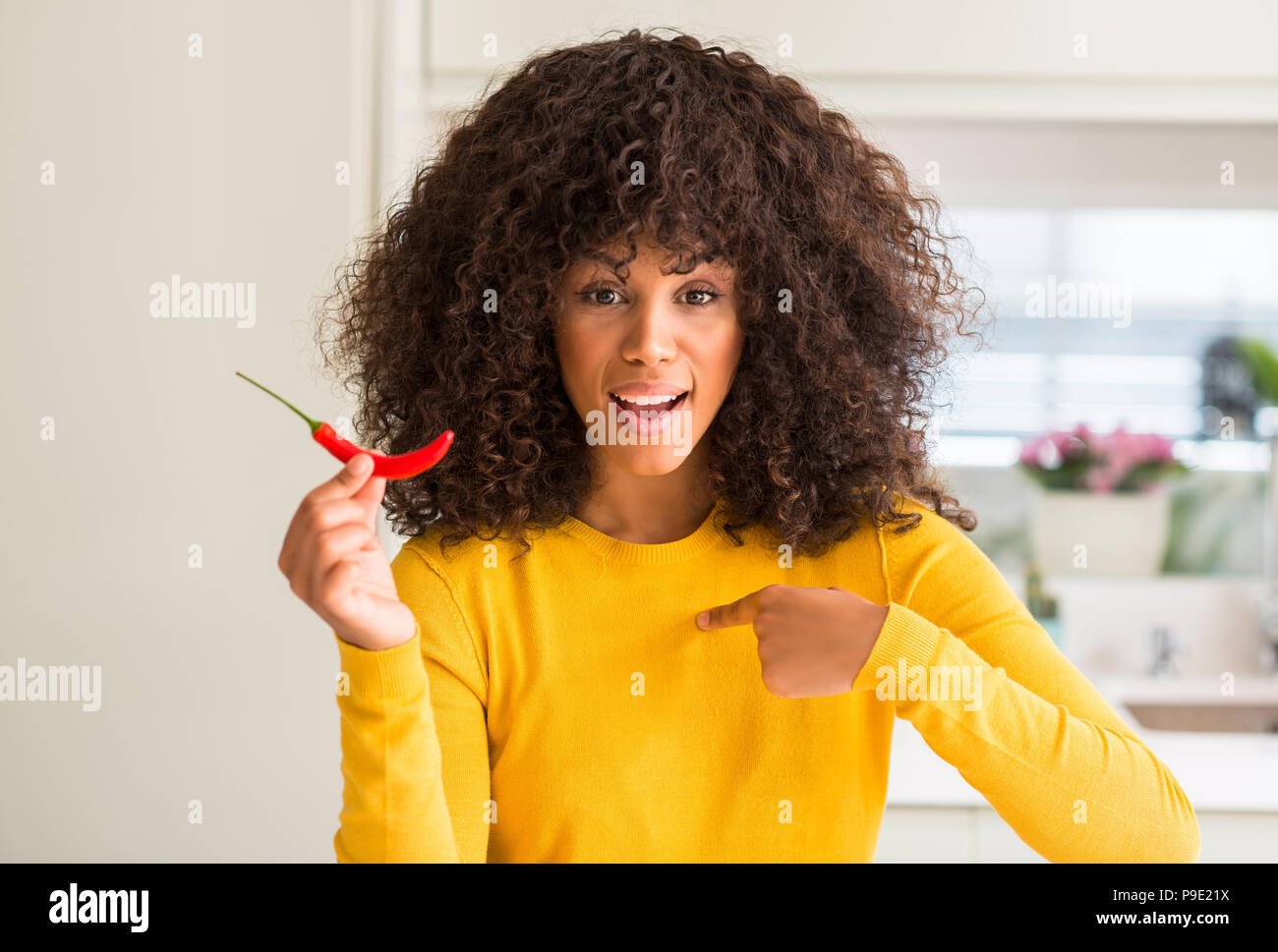 Red Hot Chili Pepper Eating Woman High Resolution Stock Photography and ...