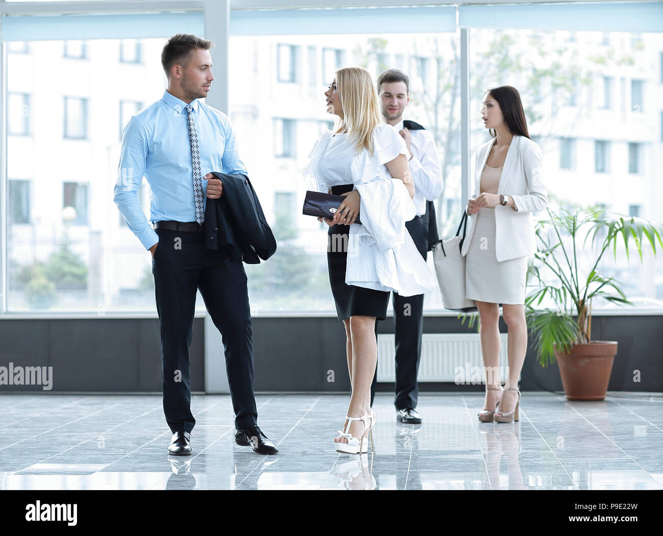 business people standing in the lobby of the modern office Stock Photo ...