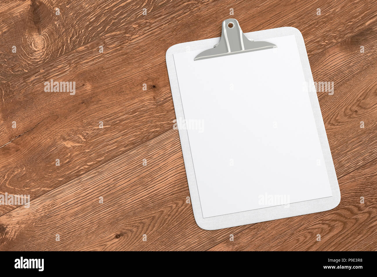 White clipboard with blank white paper pages isolated on wooden ...