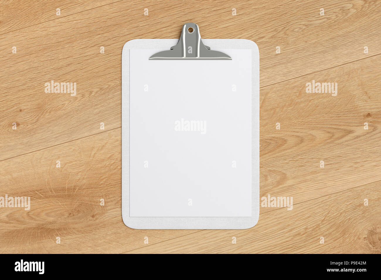 White clipboard with blank white paper pages isolated on wooden ...