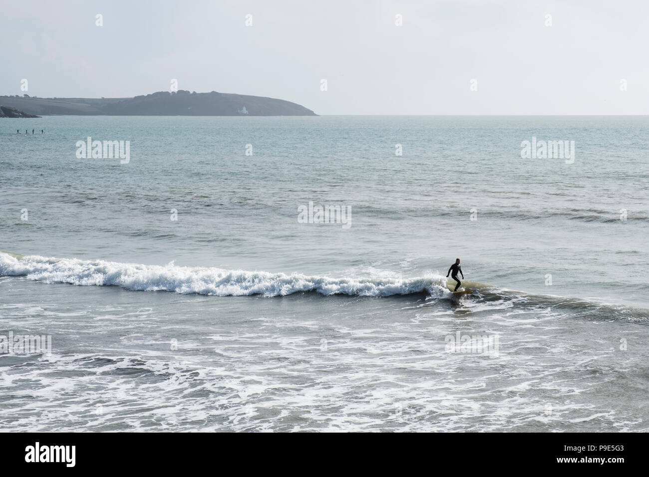 Riding surfer wearing wetsuit hi-res stock photography and images - Alamy