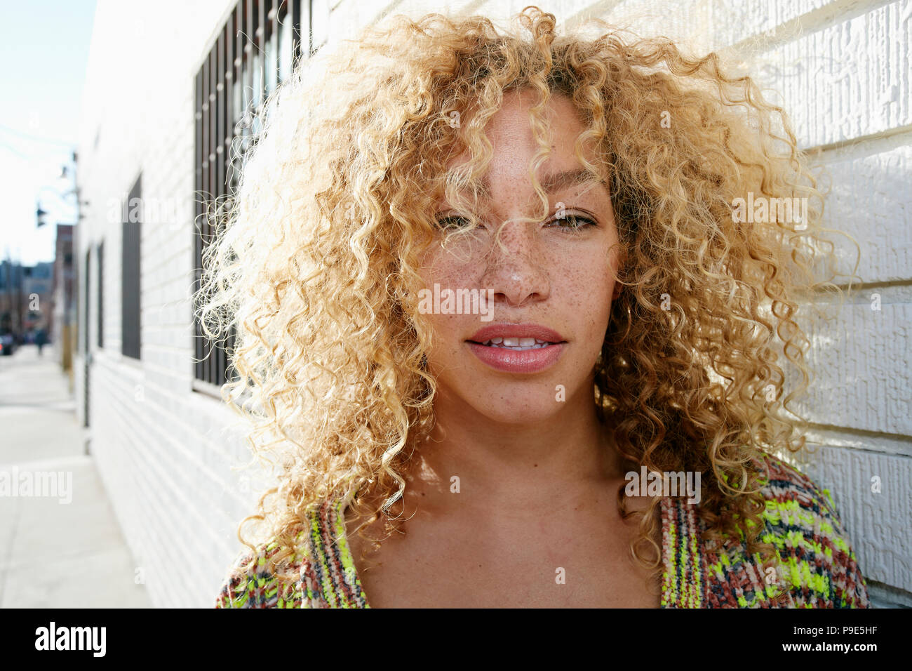 Curly blond hair hi-res stock photography and images - Alamy