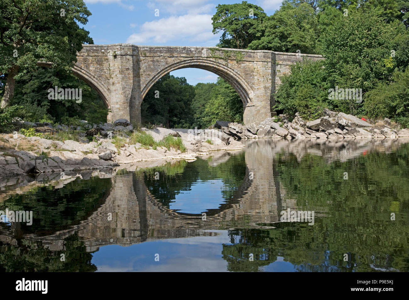 Devils Bridge triple arched bridge built of ashlar sandstone in 14th or 15th century over River Lune Whithorn Wigtownshire Scotland Stock Photo