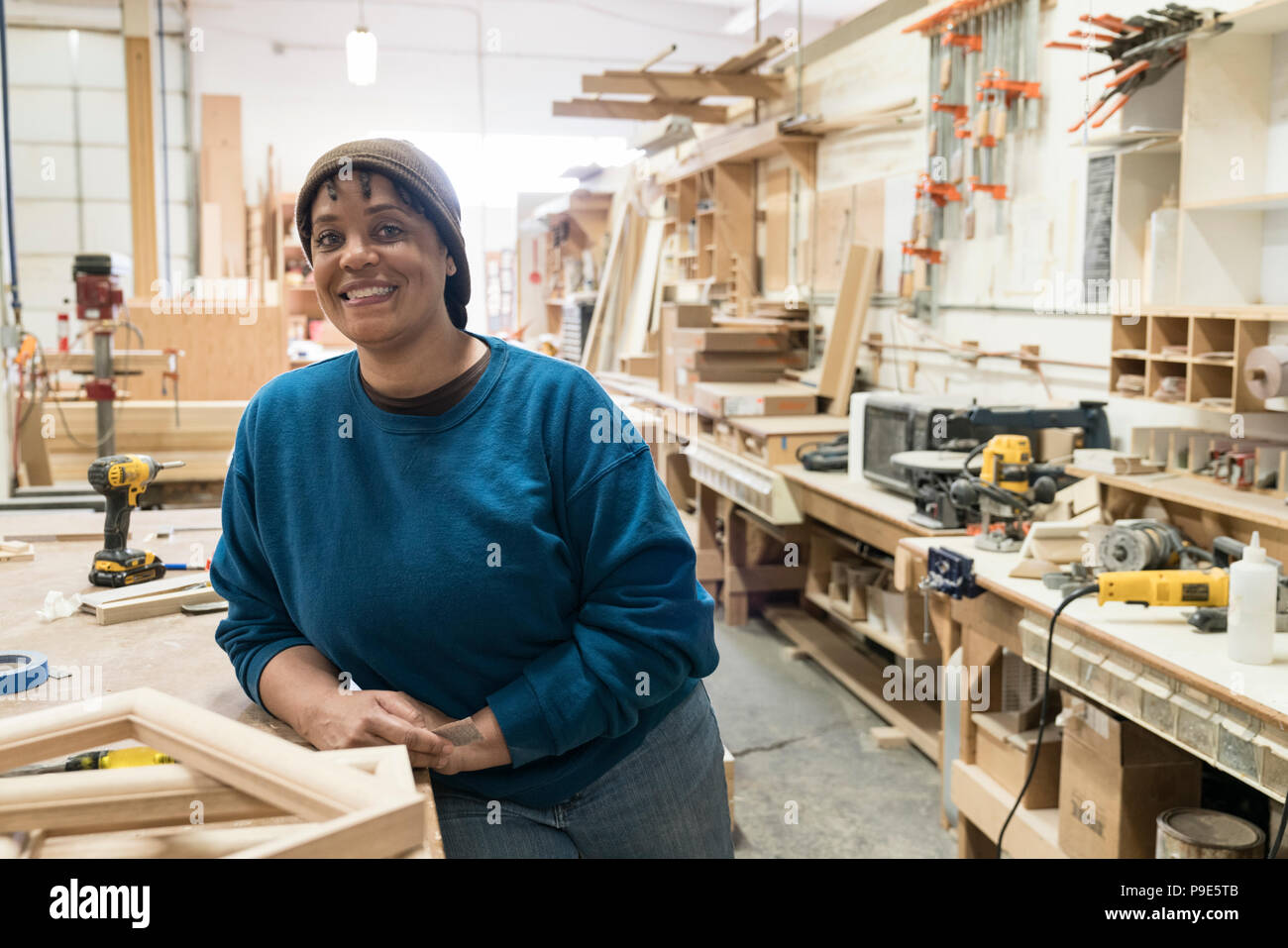 Portrait Of A Black Woman Carpenter In A Large Woodworking Shop Stock Photo Alamy